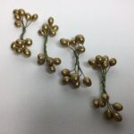Guldfarvet ilexbær på tråd