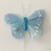 Lille lyseblå dekorativ sommerfugl