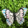 Lille lys pastelfarvet sommerfugl 