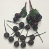 Kunstige små mørklilla bær