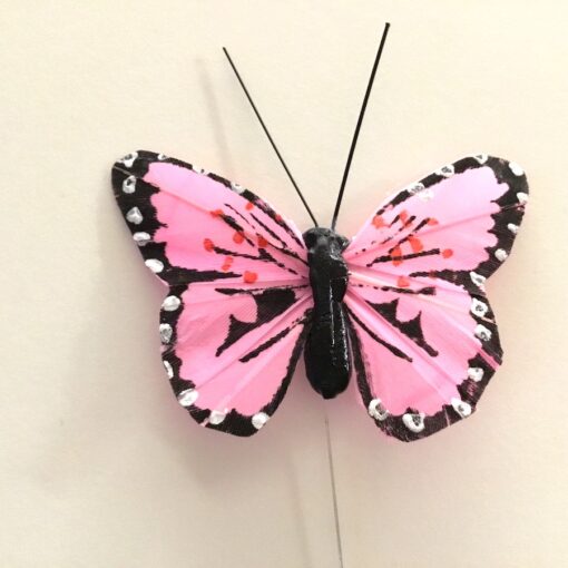 Lille rosa dekorativ sommerfugl