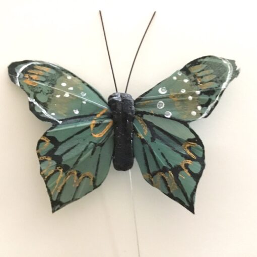 Grøn dekorativ smuk sommerfugl