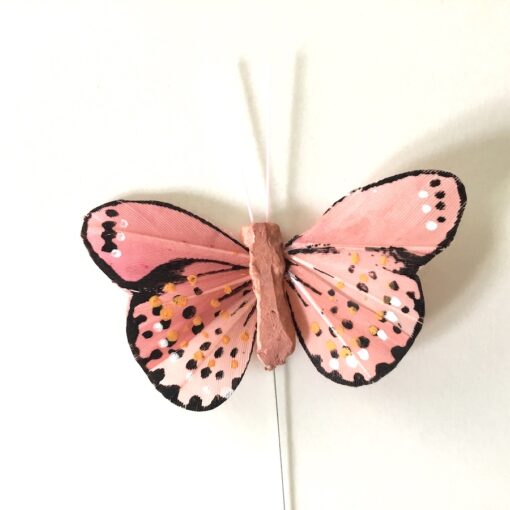 Dekorativ lille gammelrosa sommerfugl